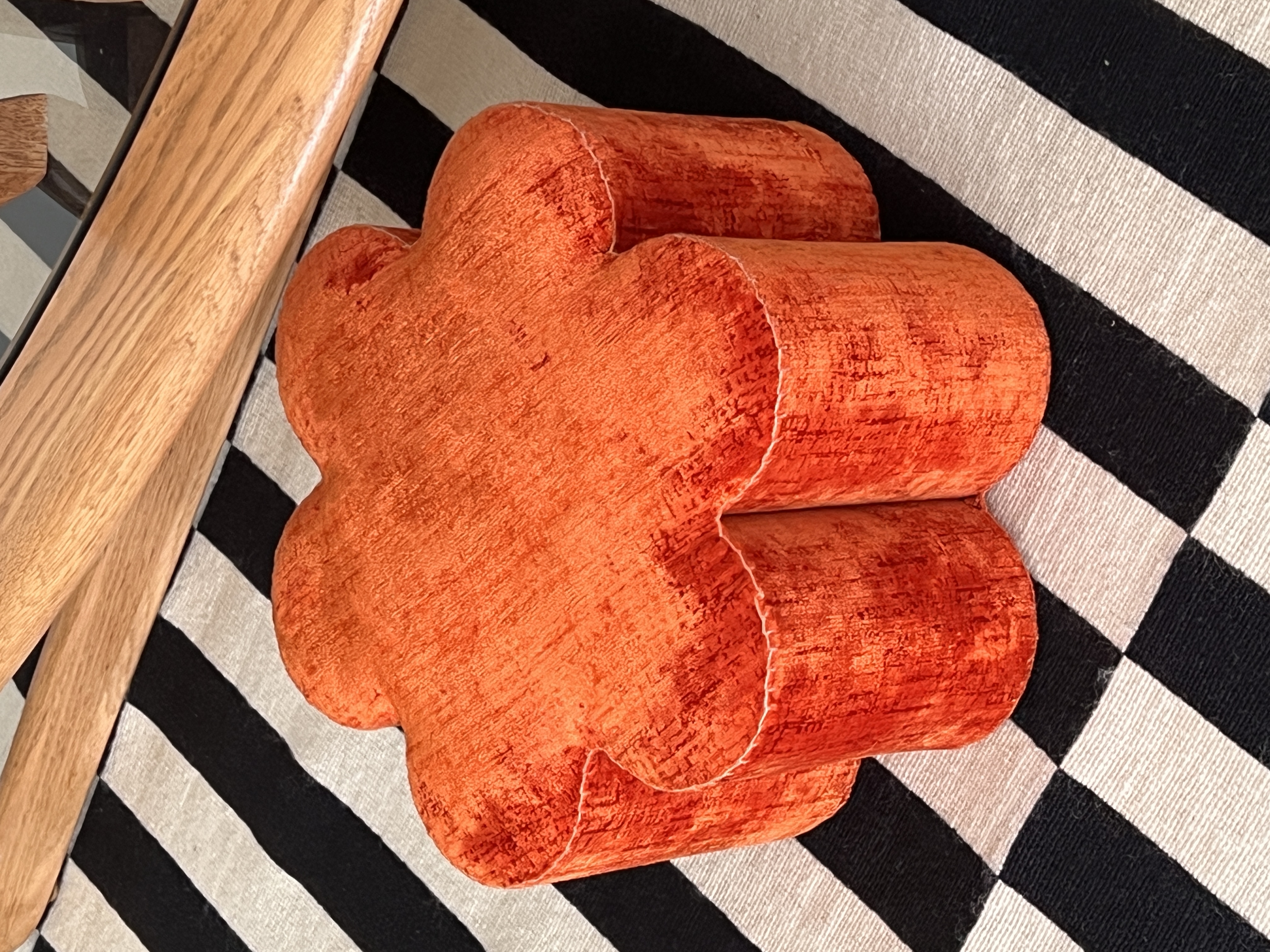Orange velvet flower-shaped ottoman